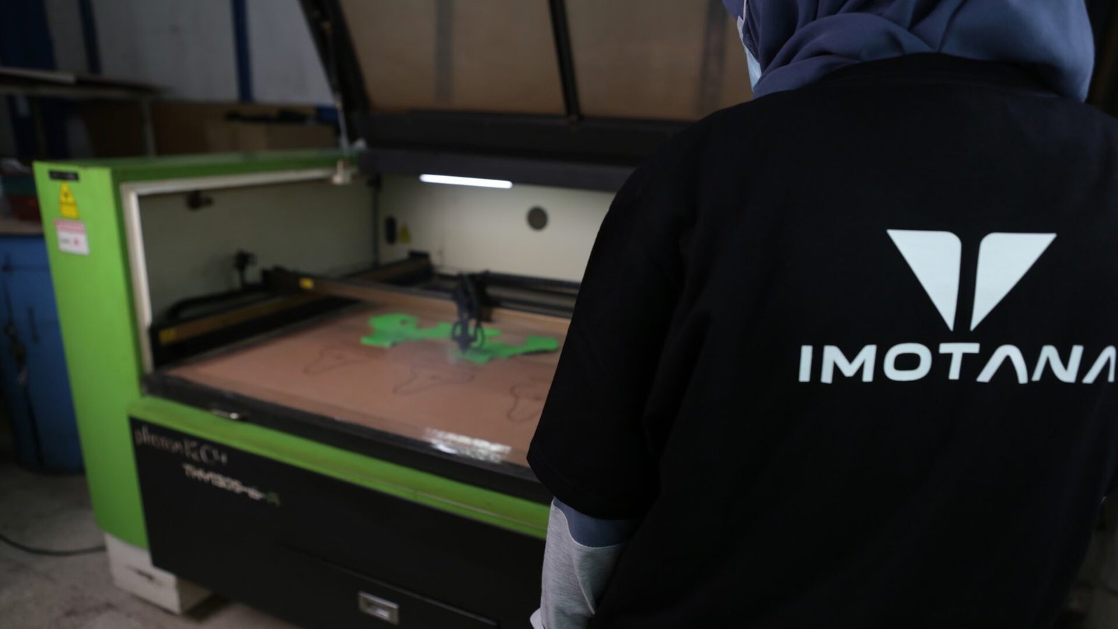 imotana-shoe-production-laser-cutting-photography Imotana shoe material being cut with a laser cutting machine.